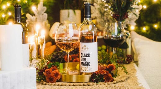 McBride Sisters Wine Club, wine set up on a table with food and flowers